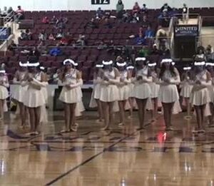 High School Dance Team Lines Up In Gym – Crowd Goes Wild When Lights Go Out