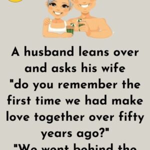 A husband leans over and asks his wife