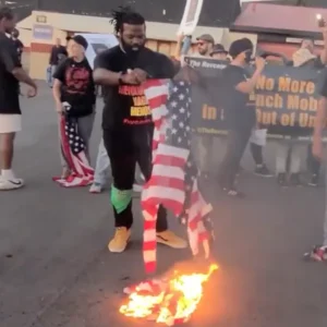 WATCH: Communists Crash Jason Aldean Concert, Burn American Flags